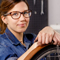 A woman employee wearing glasses